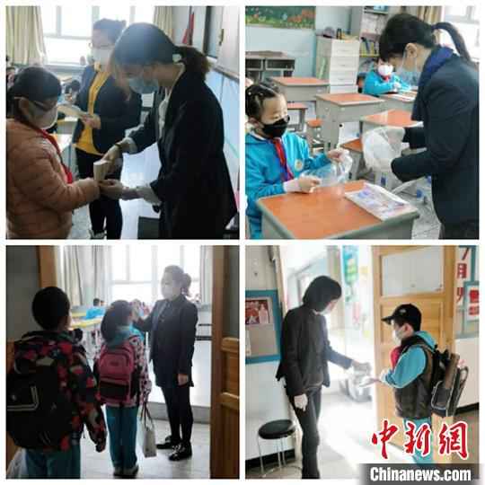 乌鲁木齐市第一小学开学第一天,老师们为学生测温。 李金艳 摄 新疆中小学和中职学校全面开学复课